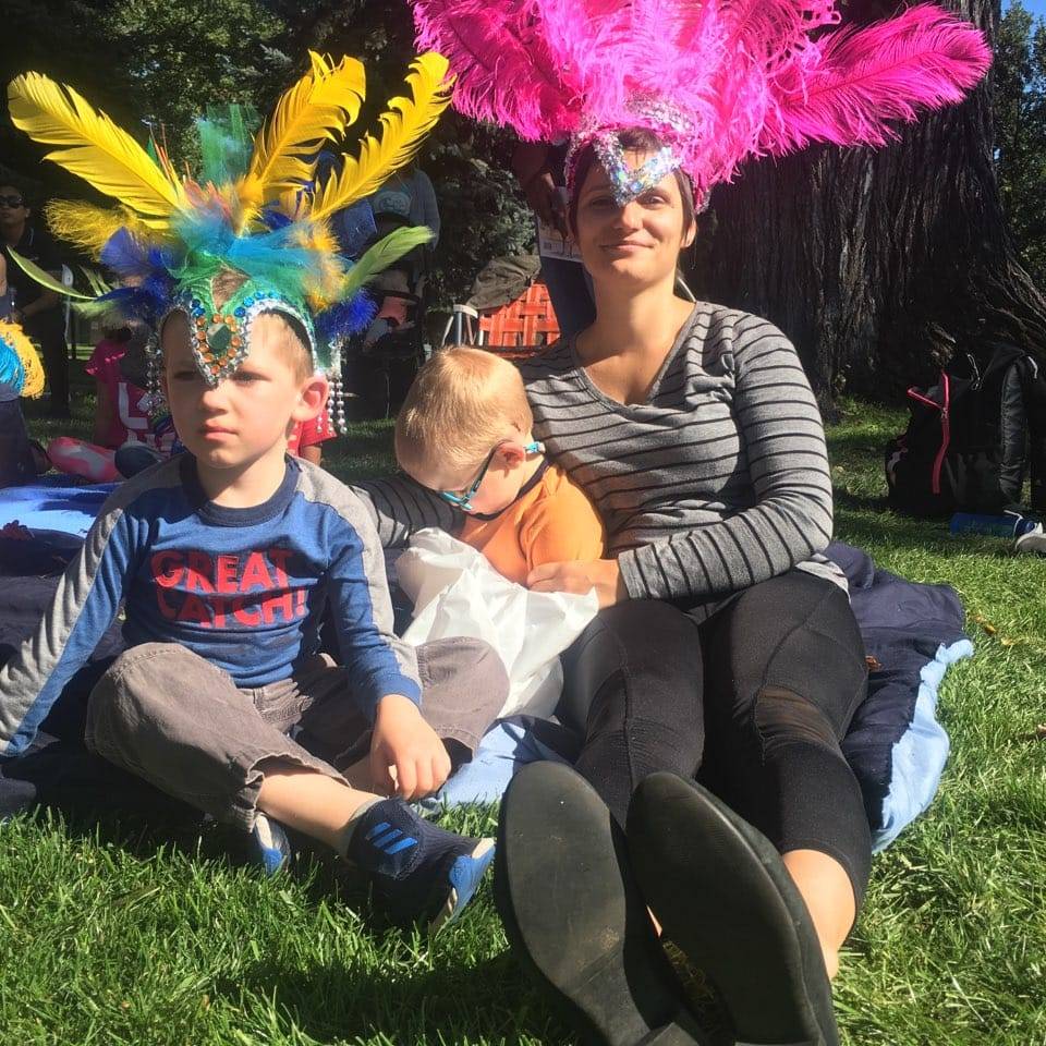 a group of people sitting at a park