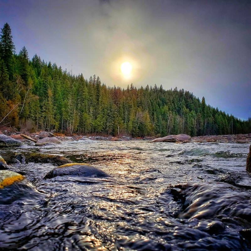 a large waterfall over a body of water