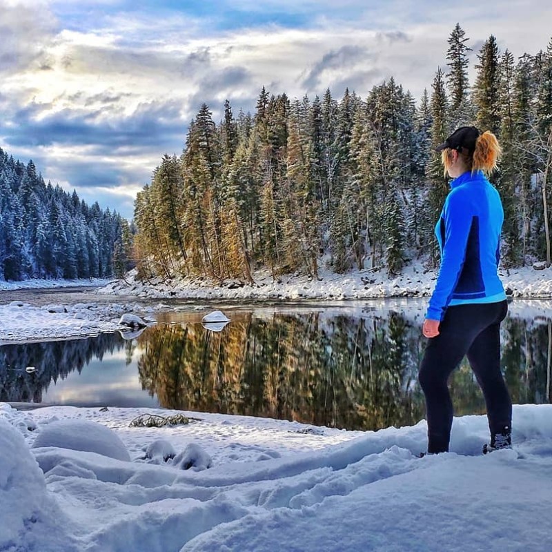 a person standing on a snow covered slope