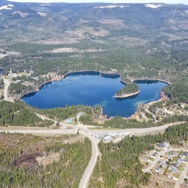 a body of water with a mountain in the background