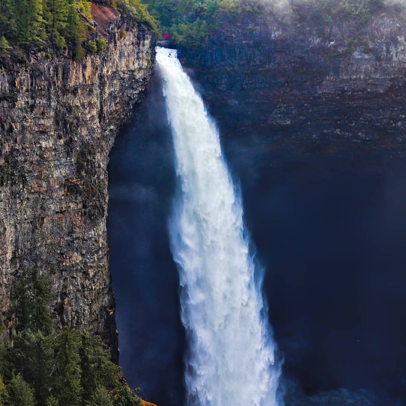 a large waterfall coming out of the water