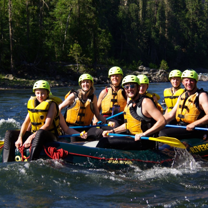 a group of people riding on the back of a boat