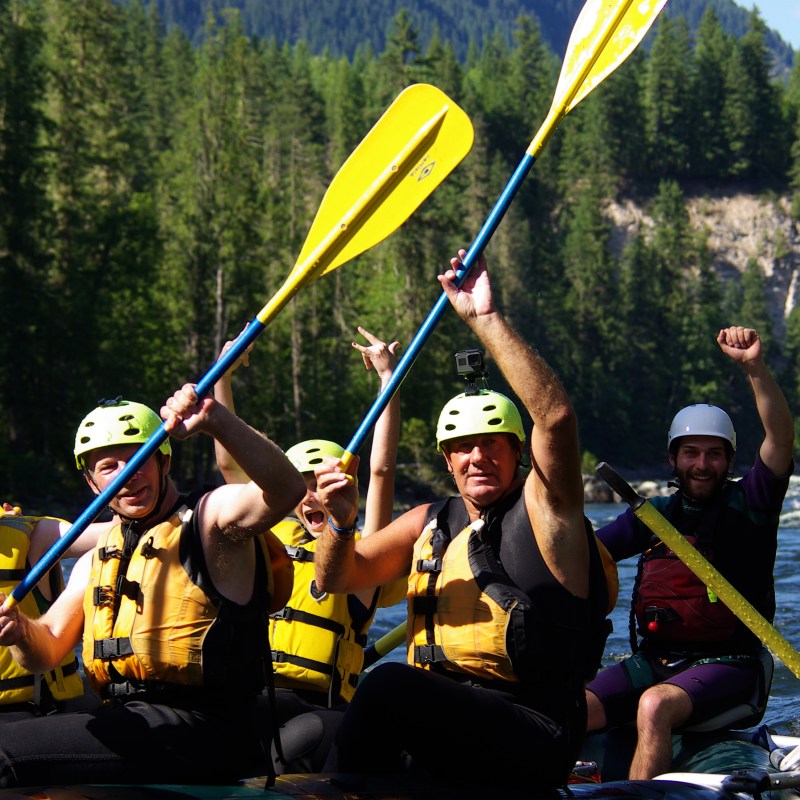 a group of people riding on the back of a boat
