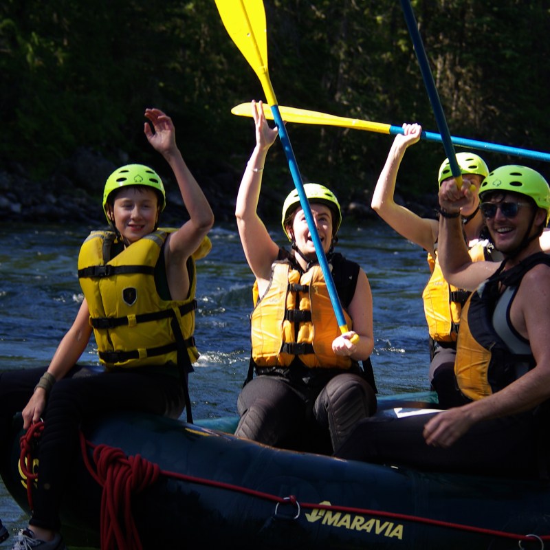 a group of people sitting on a boat