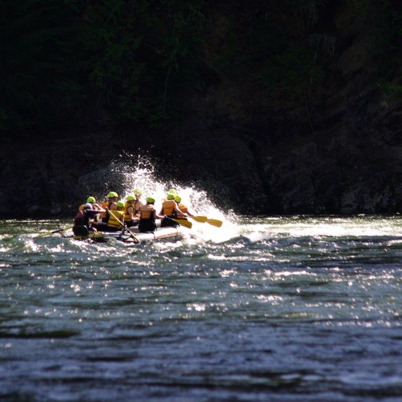 a person riding a surf board on a body of water