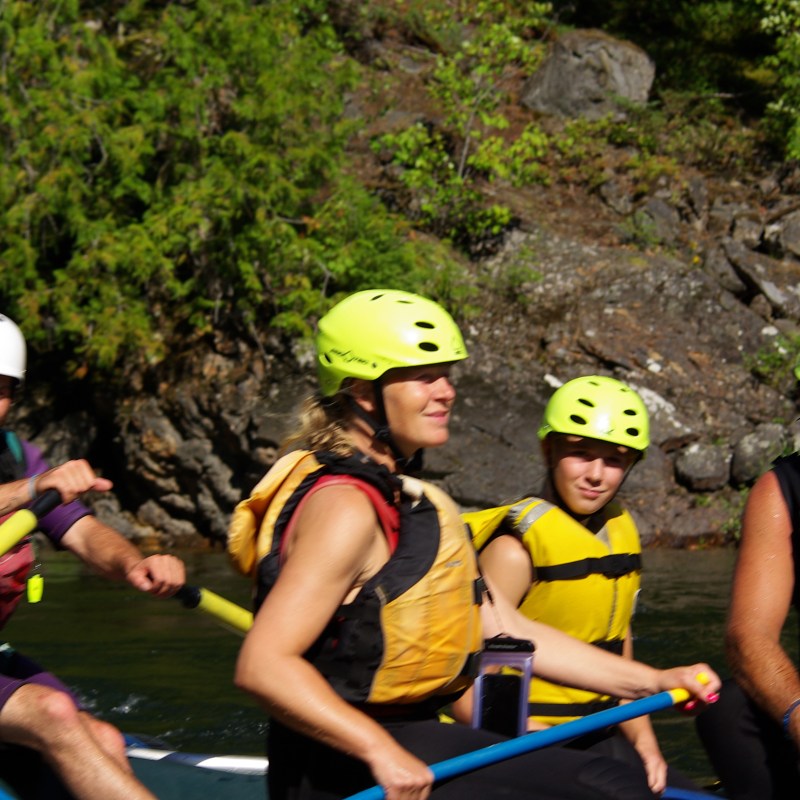 a group of people on a raft