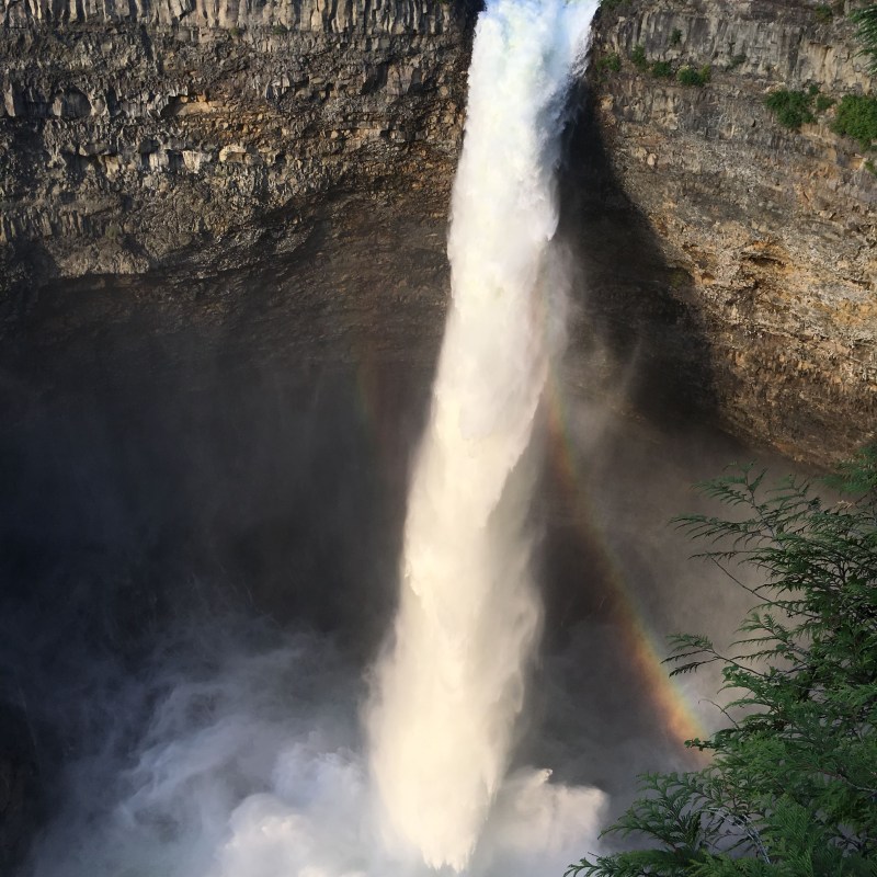 a large waterfall coming out of the water