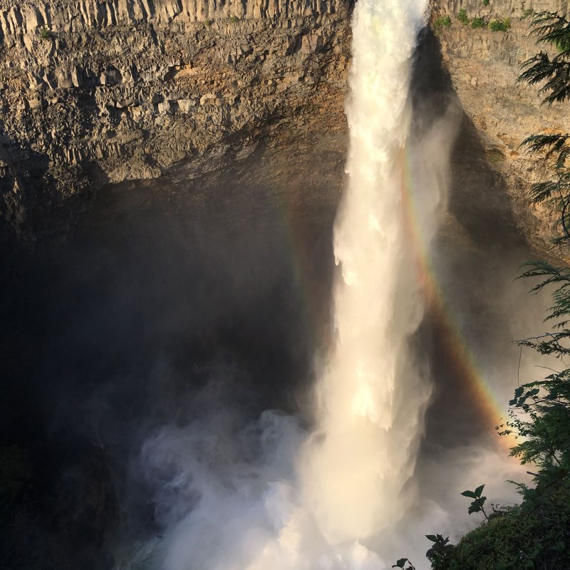 a large waterfall coming out of the water