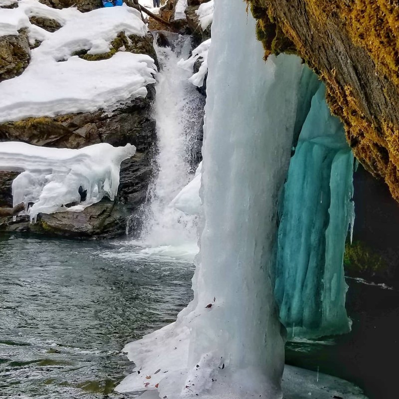 a waterfall in the snow