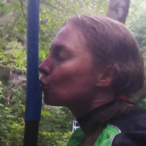 a close up of a person in a forest