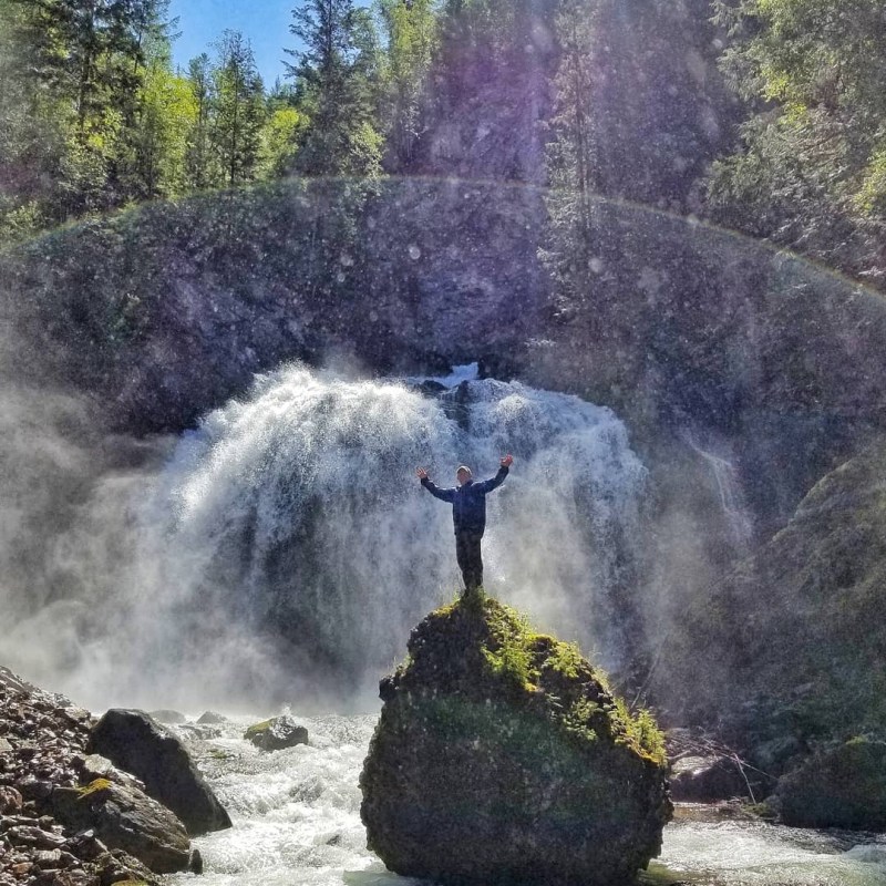a large waterfall in a forest
