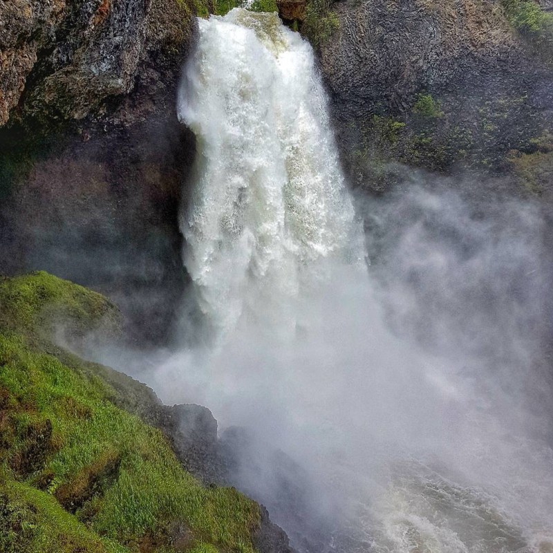 a large waterfall coming out of the water