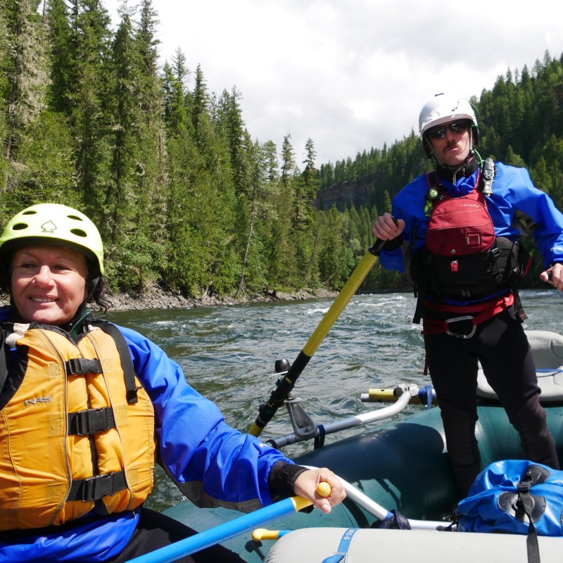 a group of people riding on the back of a boat