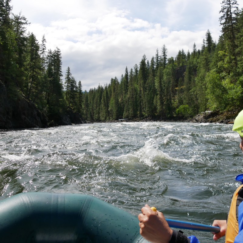 a man riding on the back of a boat
