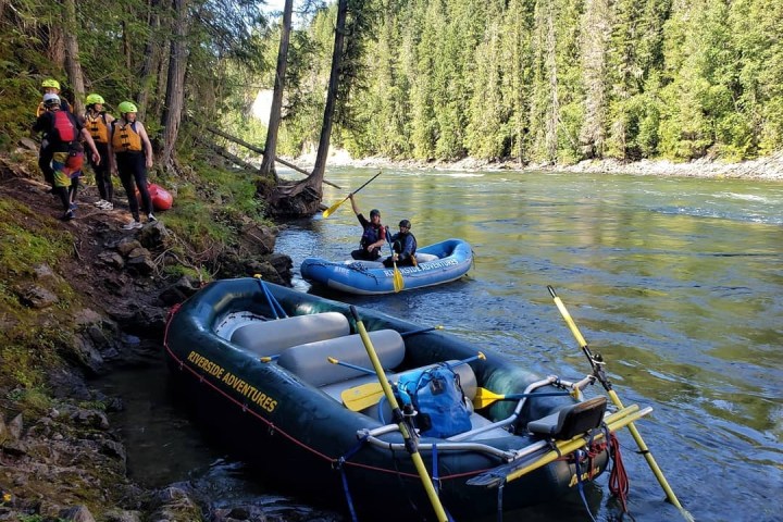 a group of people on a boat in the water