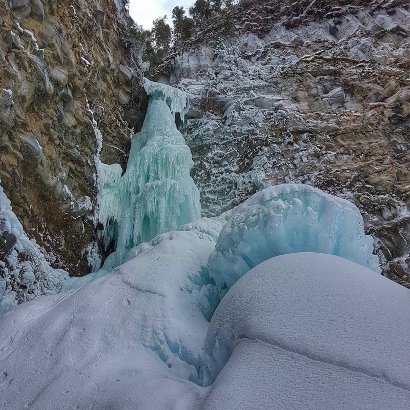 a waterfall in the snow