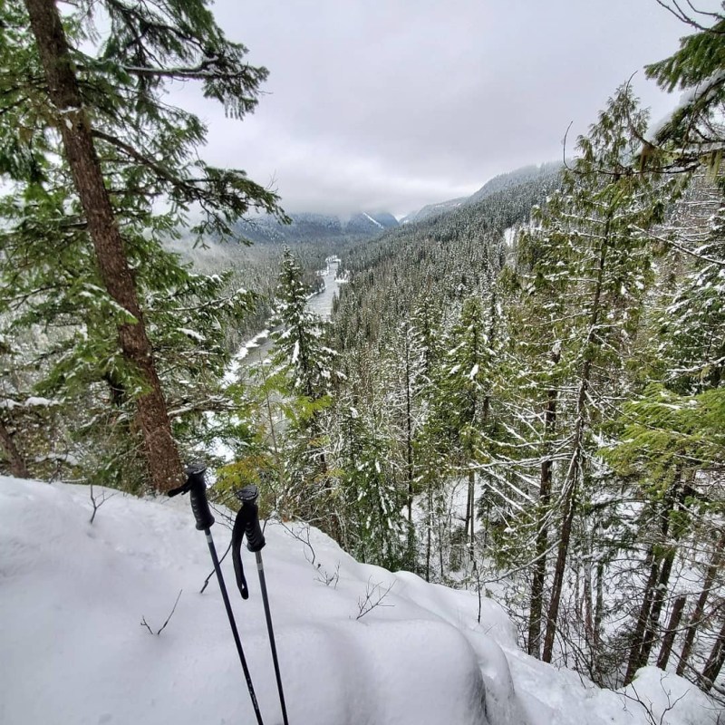 a man is cross country skiing in the snow