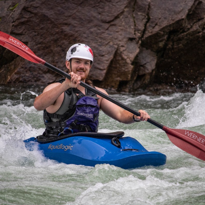 a person riding a surf board on a body of water