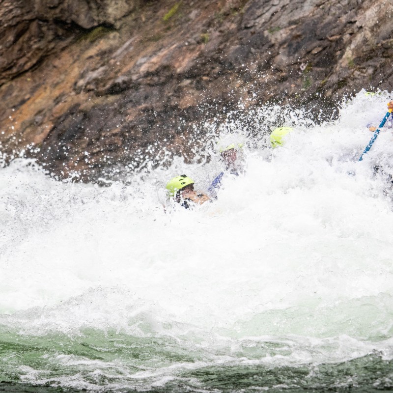 a man riding a wave on a surfboard in the water