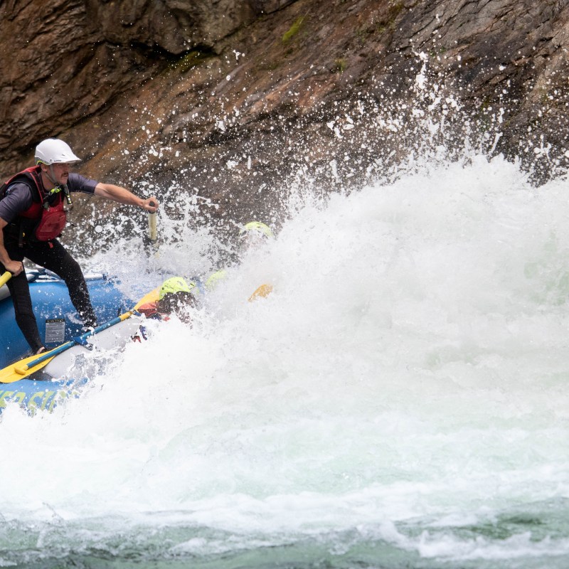 a man riding a wave on a surfboard in the water