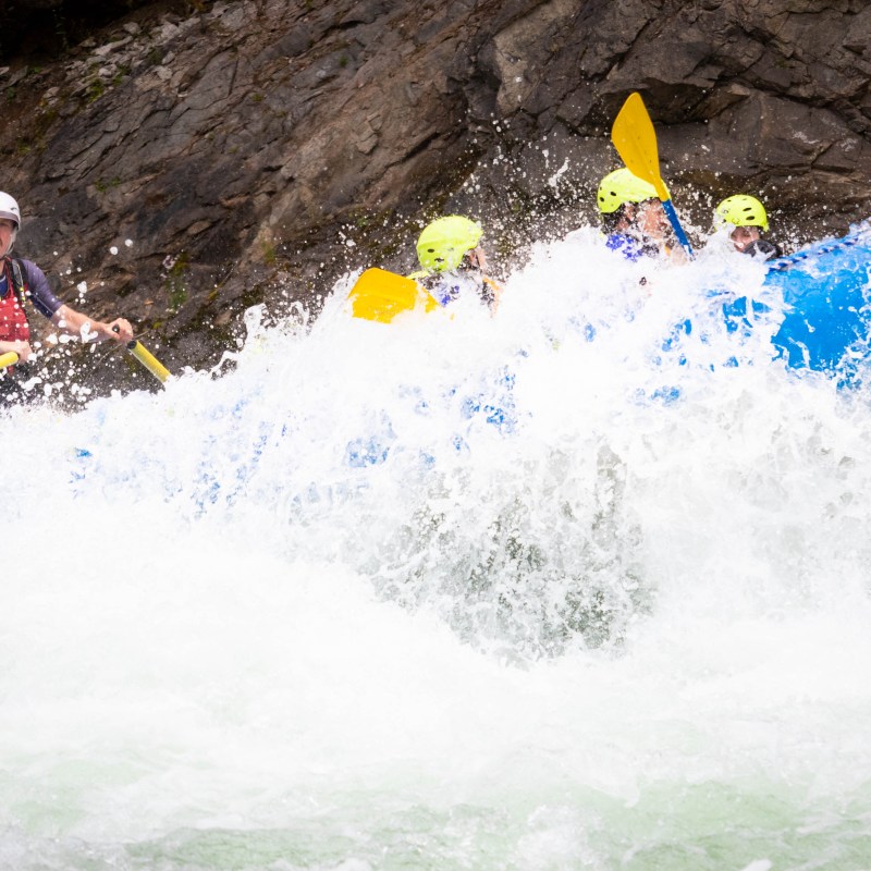 a man riding a wave on a surfboard in the water