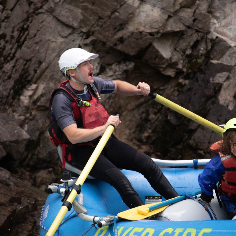 a person sitting on a rock