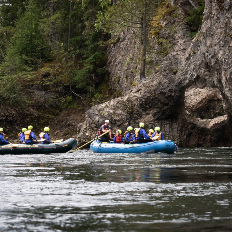 a group of people riding on the back of a boat