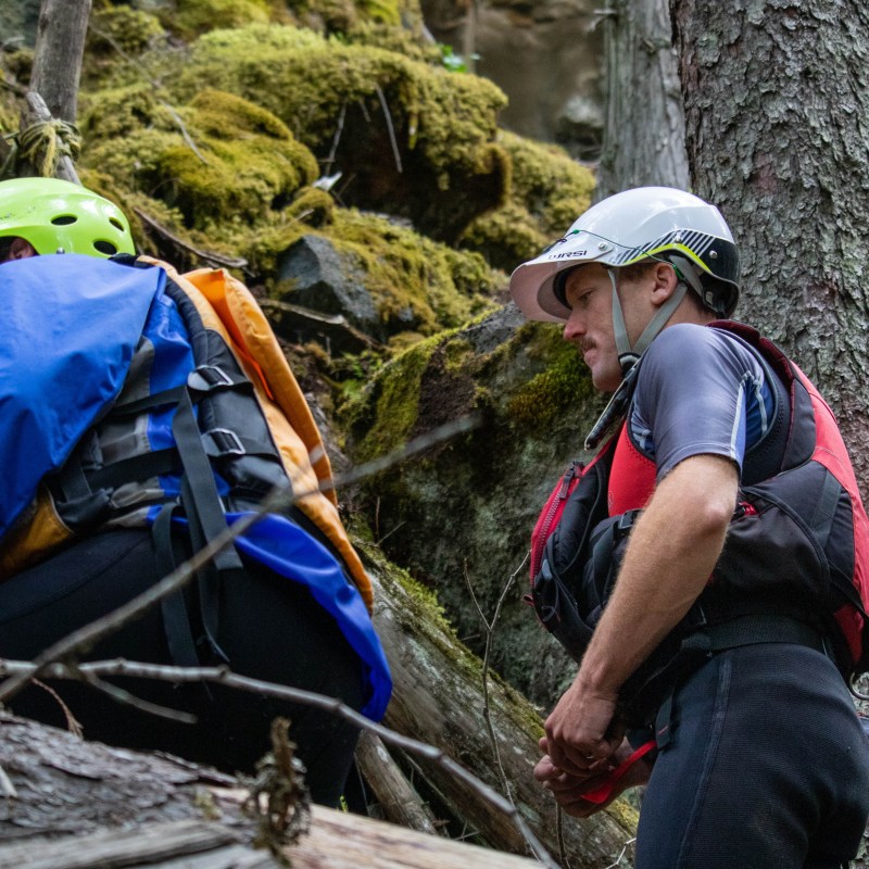 a group of people standing around a bench