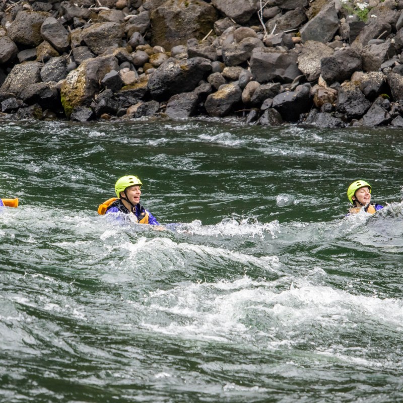 a group of people riding skis on a body of water