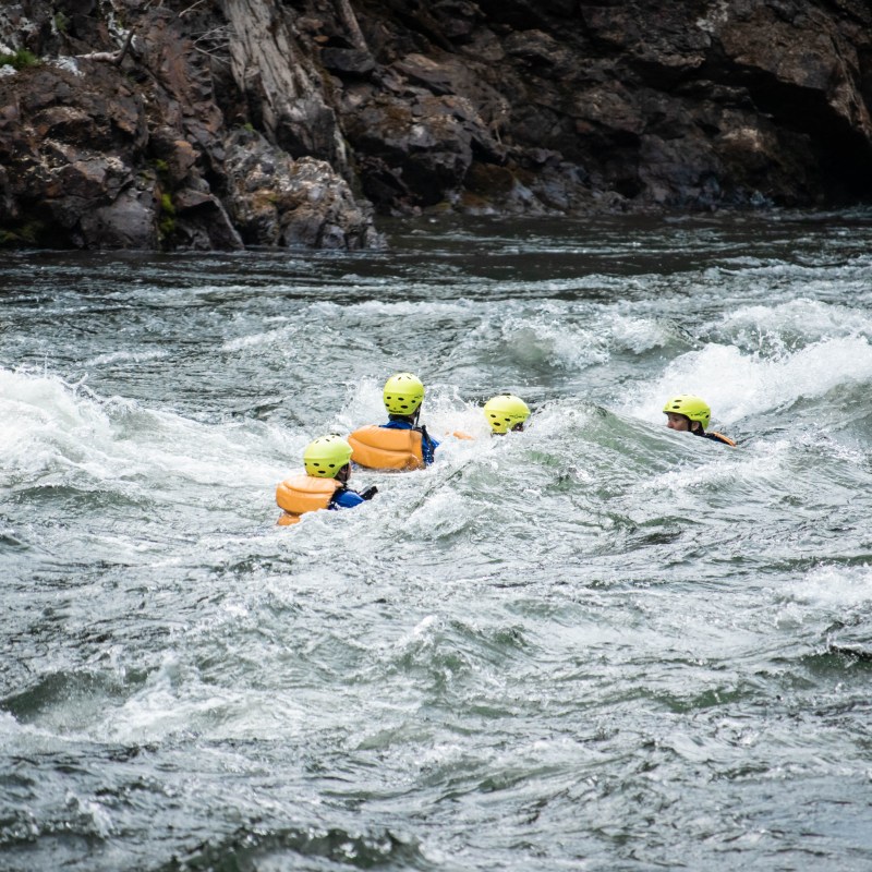 a man on a raft in a body of water