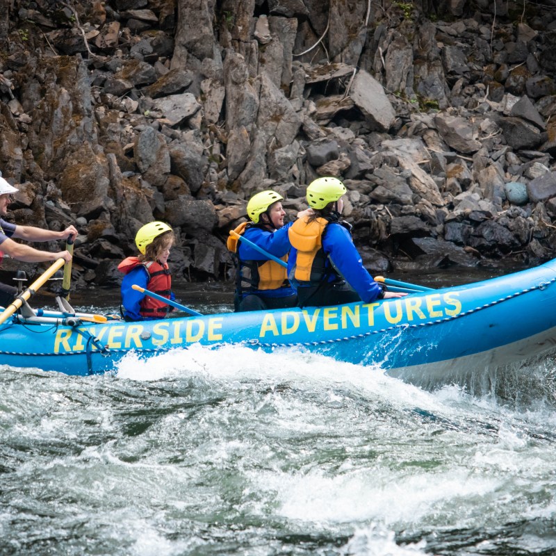 a group of people riding on the back of a boat