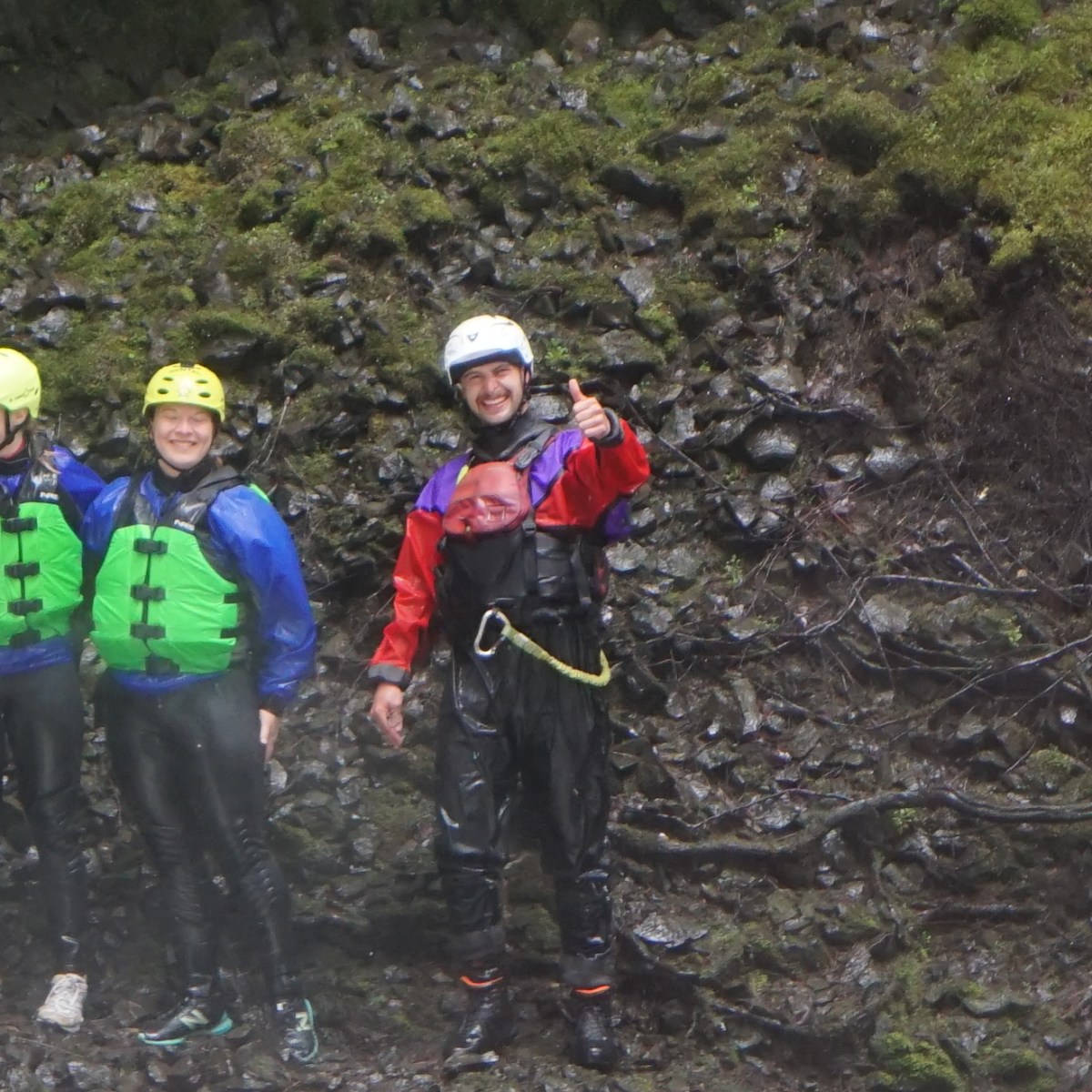 a group of people standing on top of a mountain